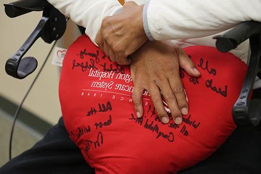 person holding stuffed heart